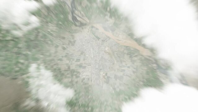Earth zoom in from space to Turkmenabat, Turkmenistan. Followed by zoom out through clouds and atmosphere into space. Satellite view. Travel intro. Images from NASA