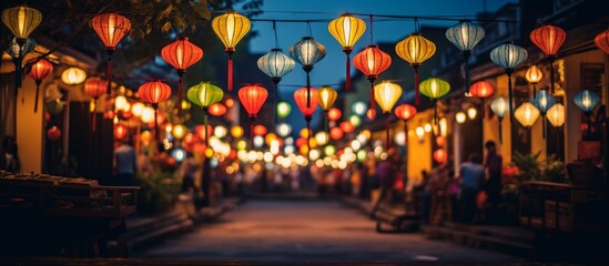 A city street adorned with vibrant lanterns illuminating the facade of buildings, creating a...