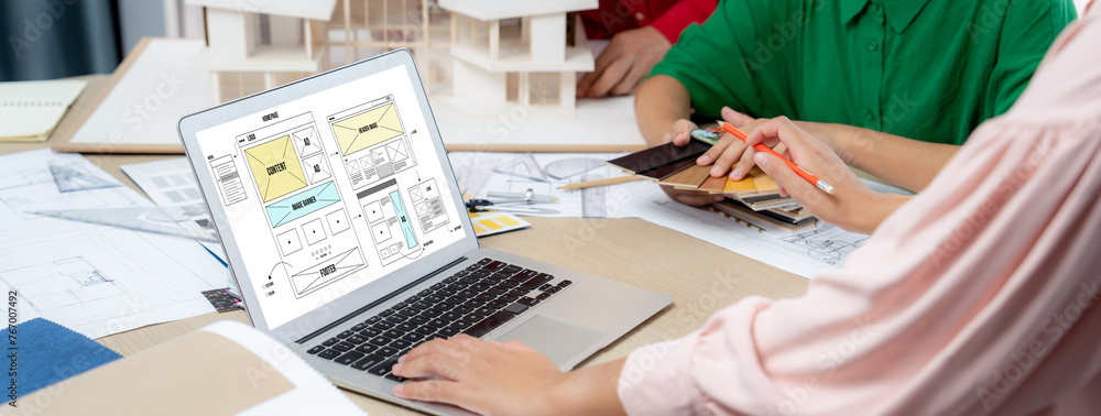 Poster cropped image of interior designer team discuss the material color while laptop displayed website wi