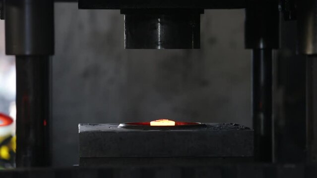press forging metal piece shaping drop hammer to give it a tool shape. Open die forging hit by hammer on a tool mould cast to form an automatic machine component part isothermal weld factory