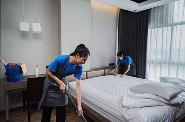 cleaning service woman worker clean bedroom at home. housekeeper cleaner feel happy and make bed look neat. housework and housekeeping cleaning service - obrazy, fototapety, plakaty