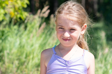 portrait of a girl, sunny weather, child's smile, blonde, summer walk, childhood, happiness, smile, joy, happy, joyful, hairstyle, jeans, girl in a pink jacket, laughter