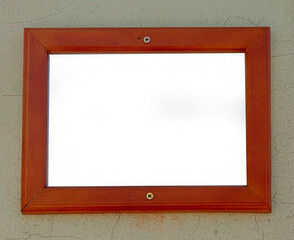 Retro empty white blank brown wooden frame hanging on a wall facade - 767018429