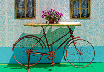 Fototapeta na wymiar Vintage retro decorative table surface with bicycle frame as a base