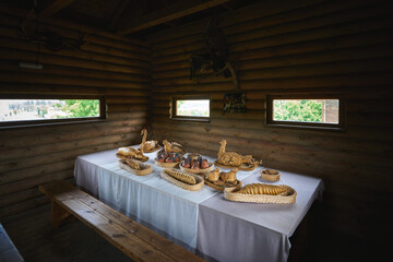 Laid table inside old Belarusian wooden house
