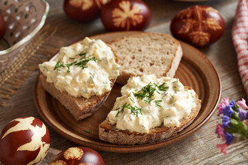 A slice of bread with bread spread made of leftover Easter eggs