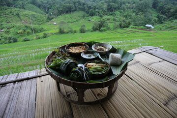 selective focus breakfast set, local food in the middle of rice fields in Thailand Eat simple meals...