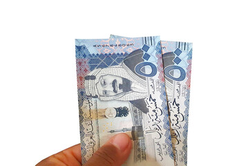 Man holding set of 500 riyals in his hand - Five Hundred Riyals Currency in Hand
