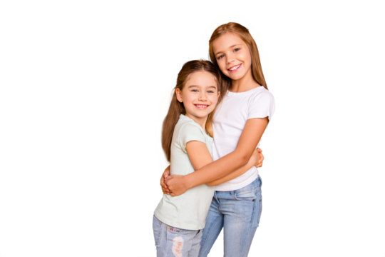 Portrait of two nice-looking cute winsome sweet attractive lovely pretty cheerful cheery positive caucasian straight-haired girls cuddling isolated over bright vivid shine yellow background