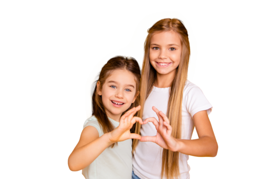 Portrait of two nice-looking adorable attractive lovely sweet cheerful positive pre-teen girls showing health care healthy heart isolated over bright vivid shine yellow background - Powered by Adobe