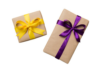 Holiday present box on a Isolated. Gift box with colored bow on white background top view close up