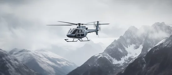 Fototapeten helicopter in the mountains © Creative-Touch