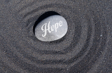 Hope stone on black sand
