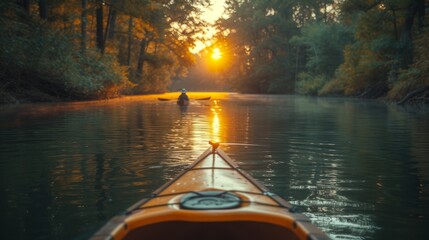   A person kayaking down a river under a sunny tree backdrop - obrazy, fototapety, plakaty