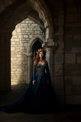 Naklejka premium Mysterious redhead queen in blue gown
