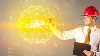 Handsome businessman with helmet drawing