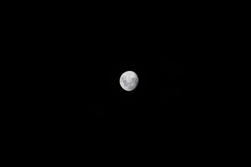 Waxing gibbous Moon shining in the black night sky