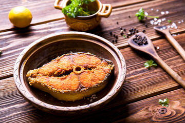 Obraz na płótnie Canvas Fried fish on wood