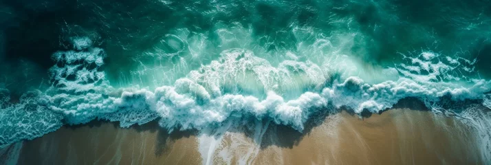 Fototapeten Aerial photography of ocean waves crushing against sand © Tetyana
