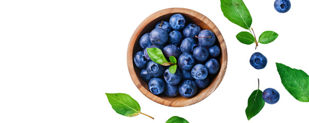 Top view of the blueberry in wooden bowl with green leaves, healthy berry fruit.