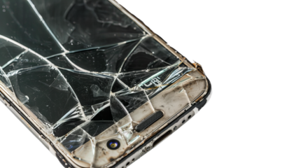 A close up of the smartphone with broken screen. Cracked modern touch screen.