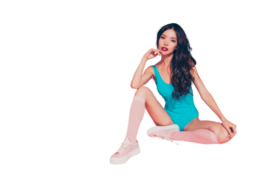 Full size photo of pretty cute dreamy hipster lady with her ideal modern hairstyle she looks at camera sitting on floor touch chin by hand isolated on vivid pastel pink background