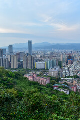 Fototapeta premium Aerial view of skyline of Taipei city at sunset from Xiangshan Elephant Mountain with colorful sky. Beautiful landscape and cityscape of Taipei downtown buildings and architecture in the city