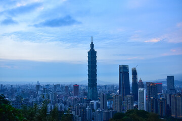 Aerial view of skyline of Taipei city with Taipei 101 Skyscraper at sunset from Xiangshan Elephant Mountain. Beautiful landscape and cityscape of Taipei downtown buildings and architecture in the city