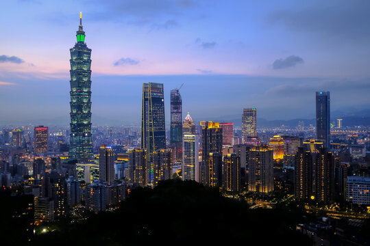Aerial view of skyline of Taipei city with Taipei 101 Skyscraper at sunset from Xiangshan Elephant Mountain. Beautiful landscape and cityscape of Taipei downtown buildings and architecture in the city