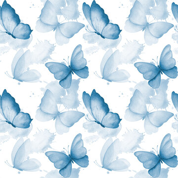 Watercolor seamless pattern with illustration of delicate blue butterflies with watercolor abstract splashes stains. Handmade, isolated