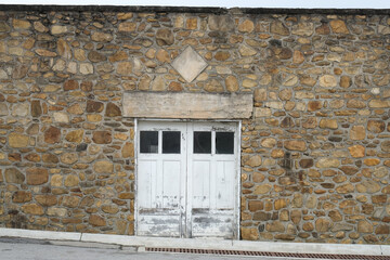 Rustic Abandoned Building With Stone Wall