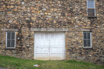 Rustic Abandoned Building With Stone Wall