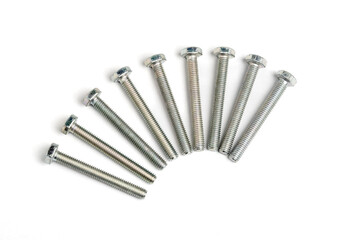 Nine stainless steel bolts isalated on white background