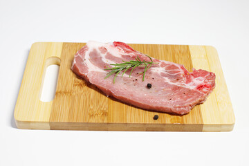 pork cutlet on a wooden kitchen board. fresh raw meat