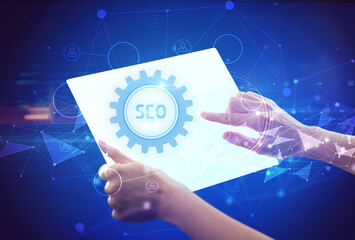 Hand holdig futuristic tablet