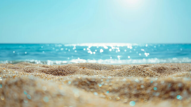 Sand beach and clear blue sea under the heat of the sun, with defocused background. Summer vacation mood banner