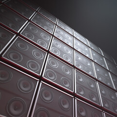 Close-Up of Monochromatic Wall Mounted Bass Speakers in Studio