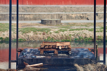 Firewood prepared for ritual funeral pyre for cremation ceremony at Pashupatinath Temple complex,...
