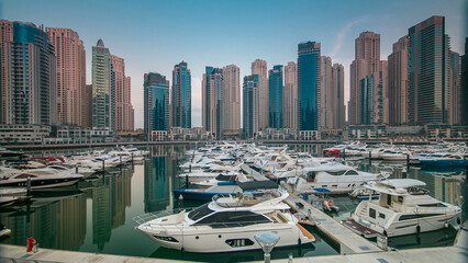 Dubai Marina at early morning hour timelapse with yachts