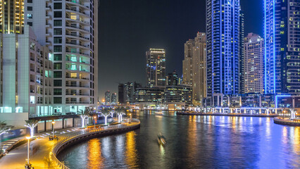 Fototapeta na wymiar Dubai Marina towers and canal in Dubai night timelapse hyperlapse