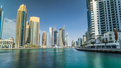 Fototapeta na wymiar Dubai Marina towers and canal in Dubai timelapse hyperlapse