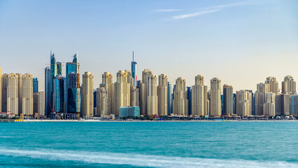 Jumeirah Beach Residence as seen from the palm jumeirah with sea timelapse. Dubai, United Arab...