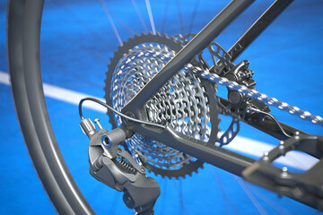 Detailed View of Bicycle's Rear Derailleur and Cassette Against Blue Background - obrazy, fototapety, plakaty