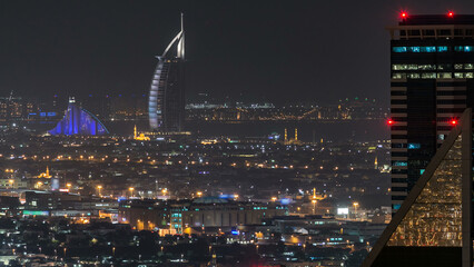 Aerial view of a big modern city at night timelapse. Business bay, Dubai, United Arab Emirates.