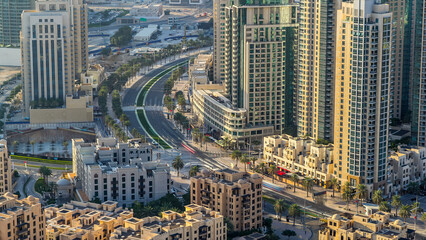 Top view of road in Dubai downtown timelapse with day traffic and skyscrapers.