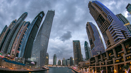 Dubai Marina towers and canal in Dubai day to night timelapse