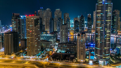 Fototapeta na wymiar Aerial top view at night timelapse of Dubai Marina in Dubai, UAE