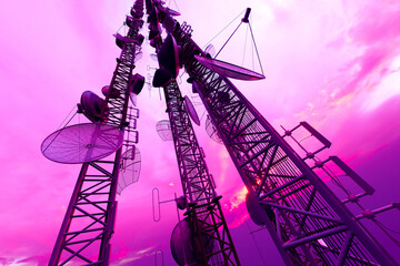 Majestic Telecommunication Towers Radiating in the Purple Hues of Sunset