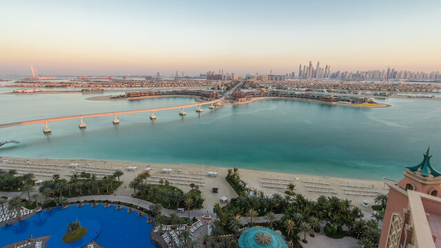 Jumeirah Palm island skyline day to night timelapse in Dubai, UAE.