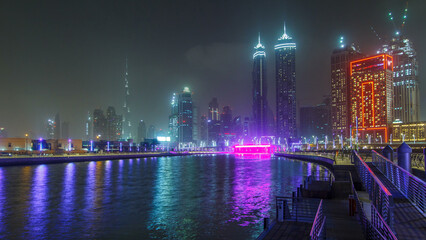 Illuminated Waterfall at the Sheikh Zayed Bridge timelapse, part of the Dubai Water Canal. Dubai,...